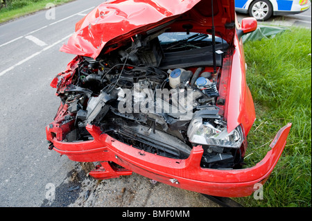 DAMAGED CAR ATFER A ROAD TRAFFIC ACCIDENT ON COUNTRY ROAD Stock Photo