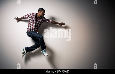 Happy young black man jumping Stock Photo