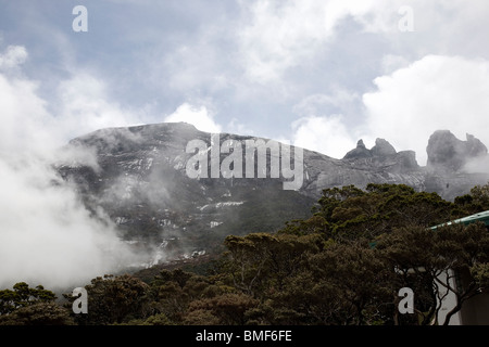 Low's Peak, Mount Kinabalu as the clouds part momentarily Stock Photo