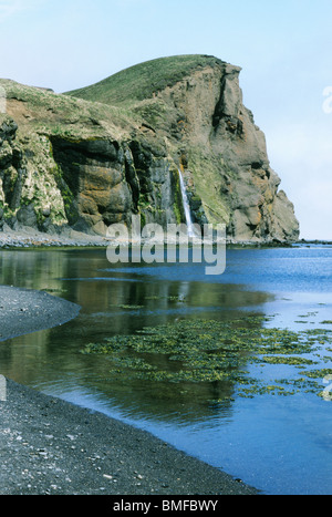 Russia, Bering Sea, Mednyy Island, Commander Islands, waterfall, Gladkovskaya Bay. Stock Photo