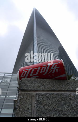 Can of Coca-Cola in base of skyscraper in Shanghai, China Stock Photo