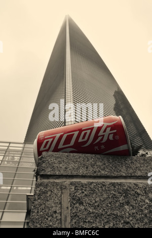 Can of Coca-Cola in base of skyscraper in Shanghai, China - in sepia and red colors Stock Photo