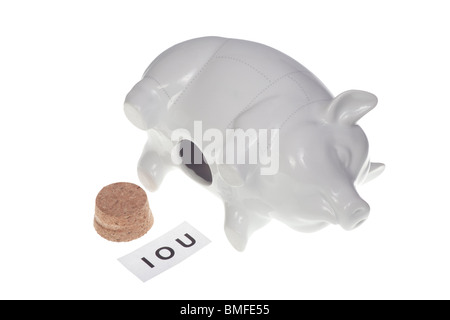 Empty piggy bank with IOU sign inside - dept Stock Photo