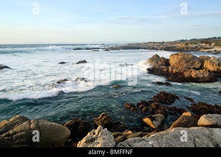 Gentle waves on rocky Asilomar Beach. Located on the Monterey Peninsula in the city of Pacific Grove. Stock Photo