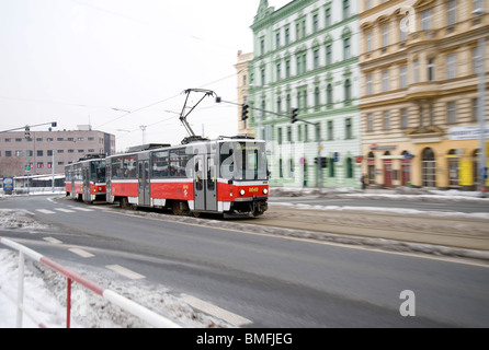 Tram rushes through the snowy streets of Prague Stock Photo