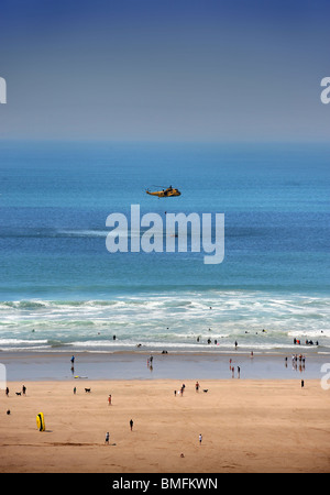 A coast guard helicopter in a training exercise off Woolacombe beach in North Devon UK Stock Photo