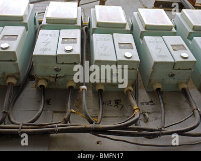 Row of electricity meters in hutongs, Beijing, China Stock Photo