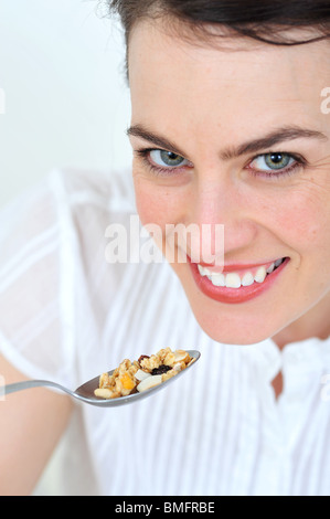 woman eating cereals Stock Photo