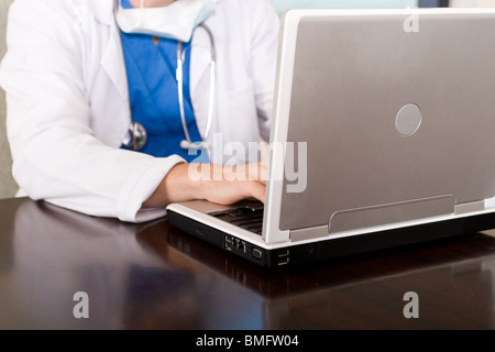 doctor using laptop in office Stock Photo