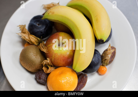 A plate of mixed fruits served as the 'dessert' course of a formal dinner, Saint Cross College, Oxford University Stock Photo