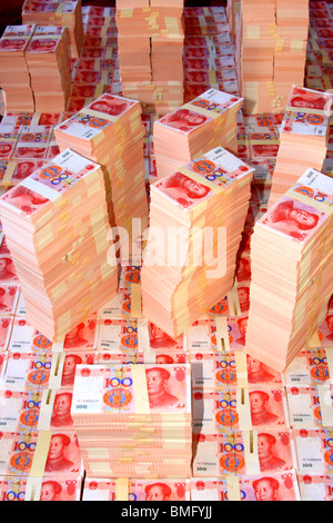 Stacks of Chinese RMB bills with one hundred Yuan in face value, Beijing, China Stock Photo