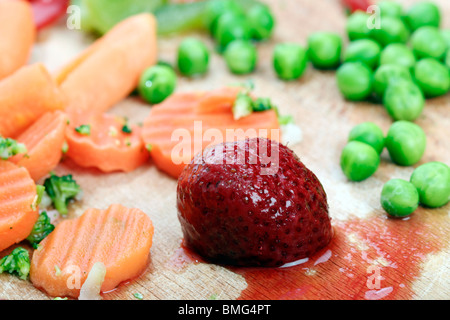Close-up of fresh fruits and vegetables plate. Stock Photo