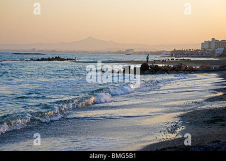 Sunset, Oroklini beach, Larnaka bay, looking to Larnaka city, Cyprus, Stock Photo