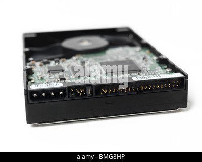 Damaged Hard Disk Drive with bent pins isolated on white background Stock Photo