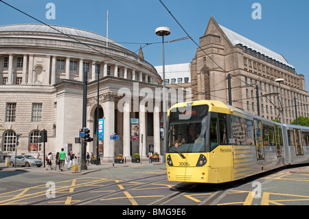 Tram in St Peter's Square,Manchester,Central Library and the Town Hall extension in the background. Stock Photo