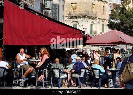 SLIEMA, MALTA. A busy cafe terrace on Triq ix-Xatt (The Strand). 2010. Stock Photo