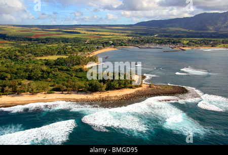 Aerial view of the north shore of Oahu, including Haleiwa town and harbor. Pineapple plantations in background. Stock Photo