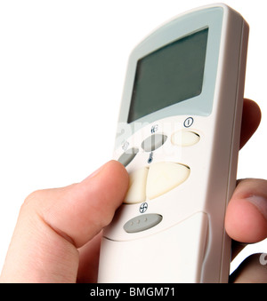 Remote control in a man hand. Isolated on white background. Stock Photo