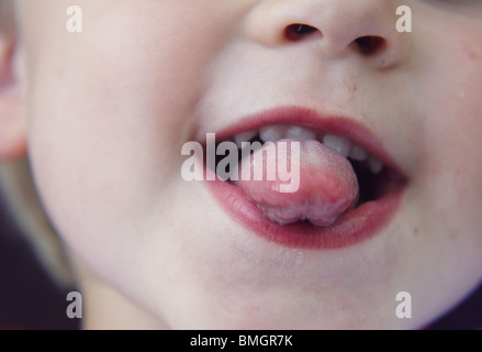 toddler boy poke out tongue Stock Photo - Alamy