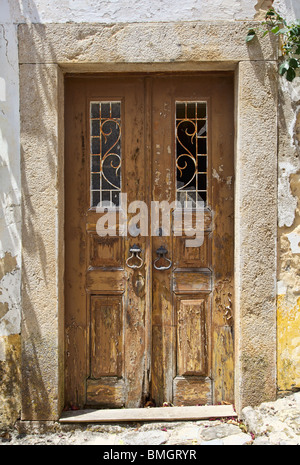 Rustic Brown Wooden Door with Peeling Paint Stock Photo