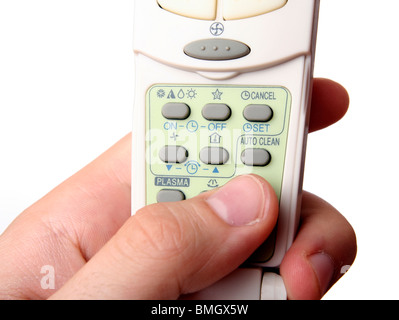 Remote control in a man hand. Isolated on white background. Stock Photo