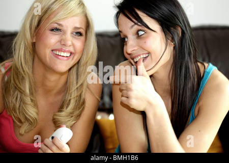 Teenage Girls Playing On Wii Game. Model Released Stock Photo