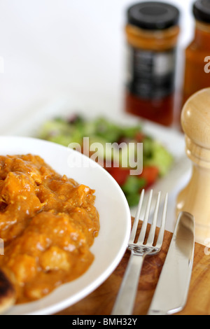 Freshly Made Indian Style Spicy Beef Madras Curry With Naan Bread And Fresh Salad With No People Stock Photo