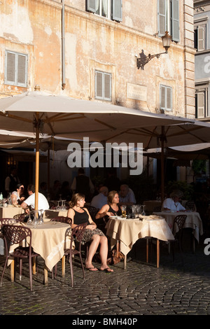 People sitted in a traditional bar in Santa Maria in Trastevere Rome Italy Stock Photo