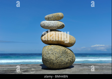 Four Zen stones and 4 elements: stone, wood, sky and water with copy space found along 17 Mile Drive Pebble Beach California USA
