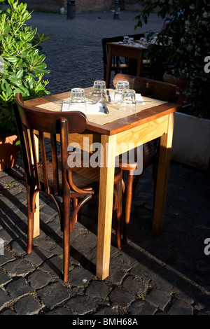 trattoria restaurant pizzeria table set on street in Rome Italy Stock Photo