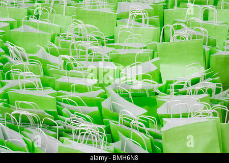 Green paper carrier bags filled with packed lunches school packed lunches. Stock Photo