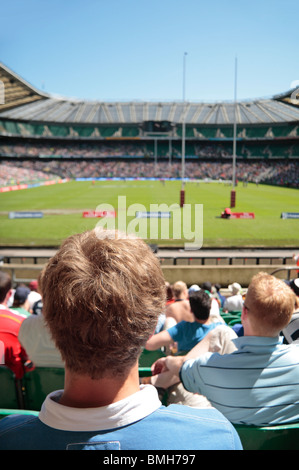 A rugby fan at Allianz Stadium, Twickenham home of English International rugby, in south west London, UK (stadium out of focus) Stock Photo