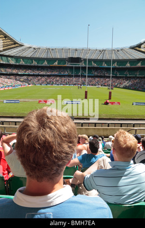 A rugby fan at Twickenham rugby stadium home of English International rugby, in south west London, UK. (stadium in focus) Stock Photo