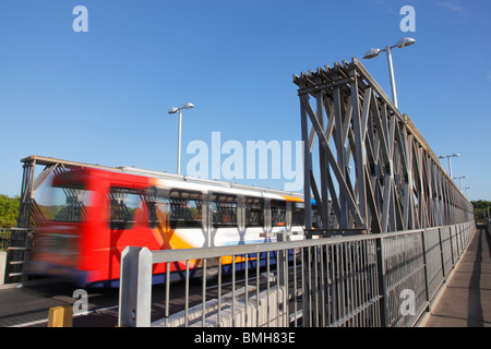 Workington temporary road bridge over the river Derwent. Blurred bus crossing the bridge. Stock Photo