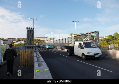 Workington temporary road bridge over the river Derwent. White van and pedestrian crossing the bridge. Stock Photo