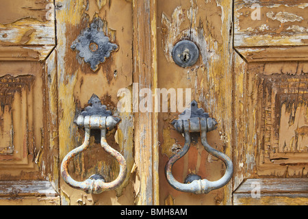 Rustic Door Lock on a Faded Brown Wooden Door Stock Photo