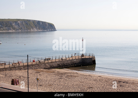 Stone jetty / pier in early morning sunlight at Swanage Stock Photo