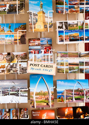 Postcards on a rack, Whitby, UK Stock Photo