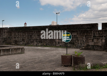 Philippines, Old city walls in Intramuros the oldest district of the city of Manila. Watch out for flying golf balls Stock Photo