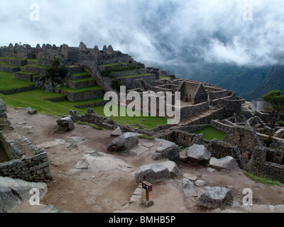 Early morning mist over the ancient Inca ruins at Machu Picchu near Cusco in Peru Stock Photo