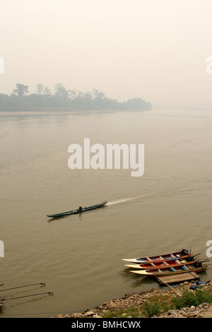 Smoke filled sky from stubble burning at Chiang Khong Mekong riverside, Thailand. Border crossing with Laos. Stock Photo