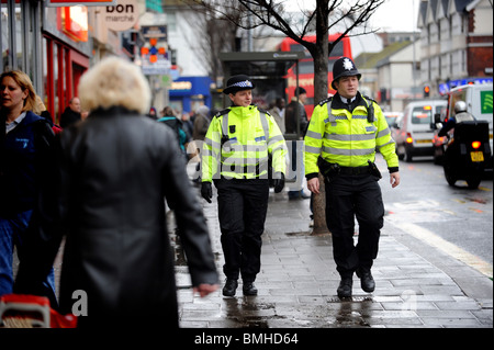 A police officer and a pcso on walk on the beat in Brighton Stock Photo