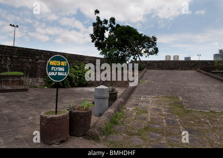 Philippines, Old city walls in Intramuros the oldest district of the city of Manila. Watch out for flying golf balls Stock Photo