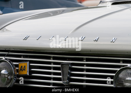The bonnet of a Hillman car showing an AA badge and foglights Stock Photo