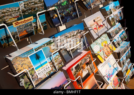 UK, England, Devon, Brixham colourful picture postcards of local views in rack for sale Stock Photo