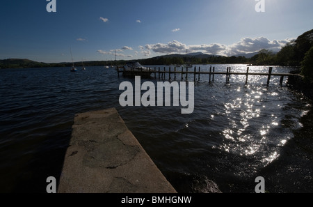 Jetty on Lake Windermere at sunset in the town of Lake Windermere Stock Photo