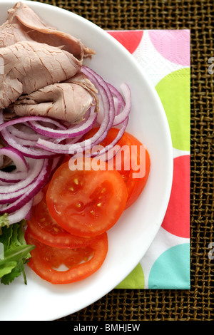 Freshly Prepared Cold Roast Beef Salad With Tomatoes, Red Onions And Green Leaves With No People Stock Photo