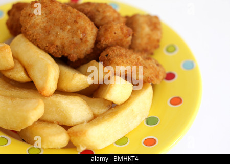 Freshly Cooked Or Prepared Breaded Scampi Tails With Chips Or Fries Served On A Plate With No People Stock Photo