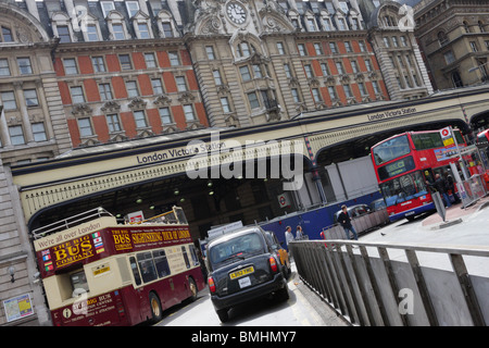 Three forms of transportation await their customers,situated in the forecourt of Victoria railway station in London. Stock Photo