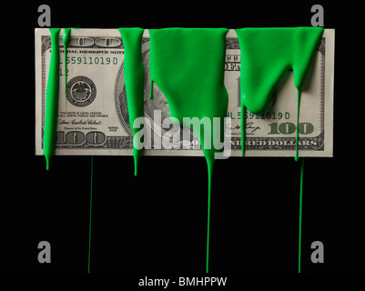 American currency covered in green paint Stock Photo